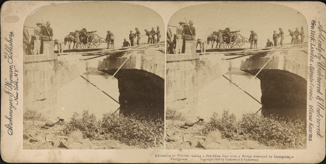 Advancing on Malolos – taking a Hotchkiss Gun over a Bridge destroyed by Insurgents, Philippines.